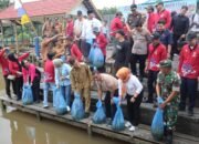 Dandim 1013 Muara Teweh Hadiri Kegiatan Restocking Benih Ikan Tahun 2024 di Desa Trinsing